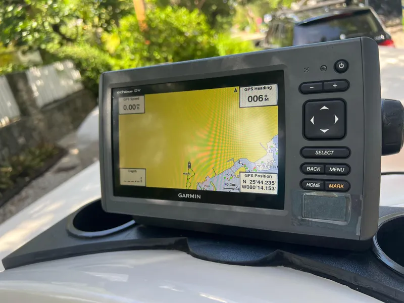 Slide: The Image of Garmin GPS device on a 2001 Hewes 21 REDFISHER boat displaying navigation map. - 9