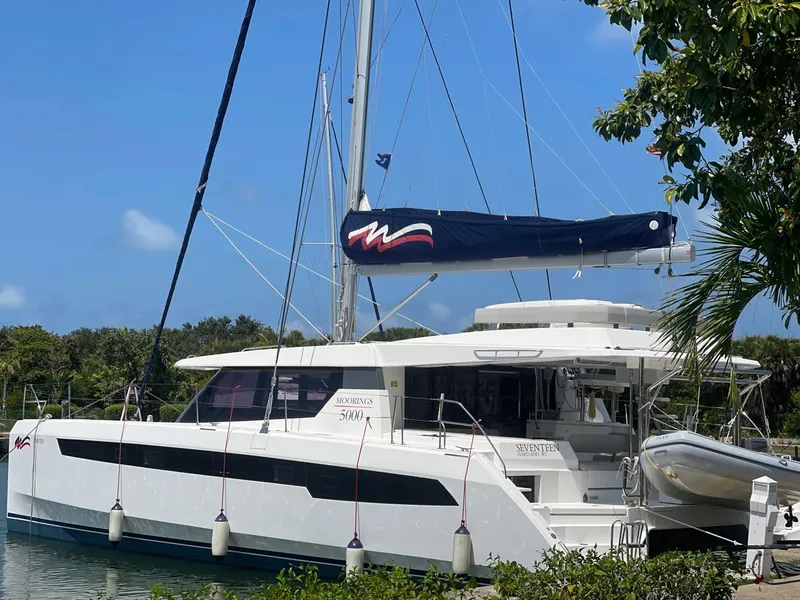 Slide: The Image of 2020 Leopard 50 catamaran docked in a tropical marina. - 0
