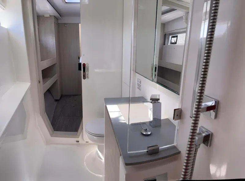 Slide: The Image of Modern bathroom interior in a 2020 Leopard 50 yacht, featuring sleek fixtures and ample lighting. - 11