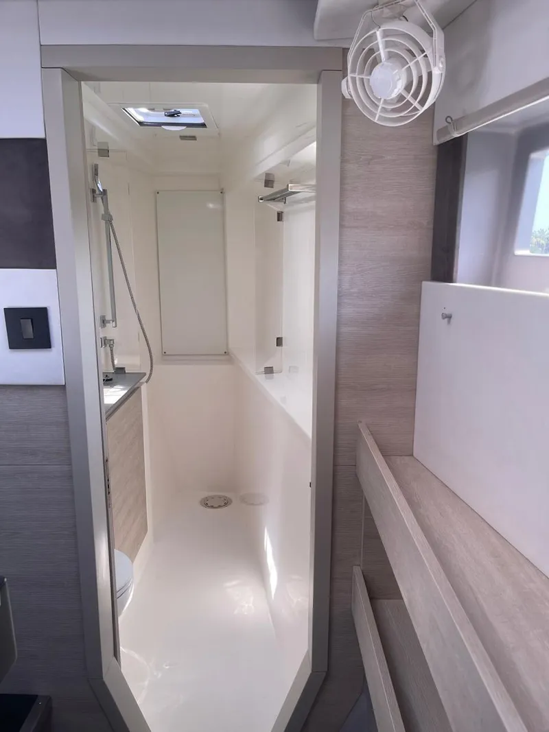 Slide: The Image of Modern bathroom in a 2020 Leopard 50 yacht with sleek design and ample lighting. - 12