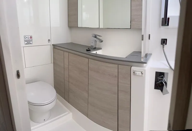 Slide: The Image of Modern bathroom in a 2020 Leopard 50 yacht with sleek cabinetry and fixtures. - 16