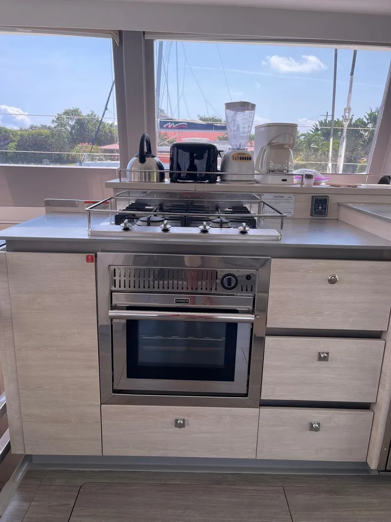 Slide: The Image of Modern kitchen in a 2020 Leopard 50 yacht with stove and oven. - 17