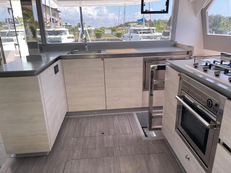 Slide: The Image of Modern kitchen on a 2020 Leopard 50 yacht with sleek cabinetry and stainless steel appliances. - 18