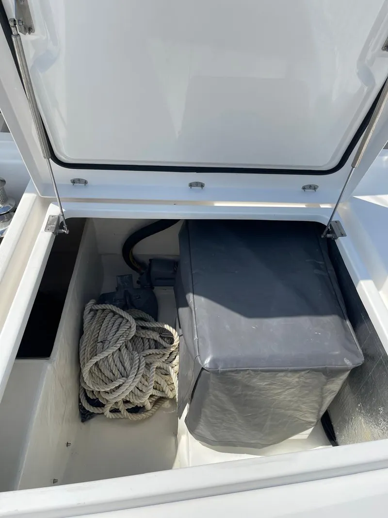 Slide: The Image of Storage compartment of a 2020 Leopard 50 yacht with rope and covered equipment. - 19