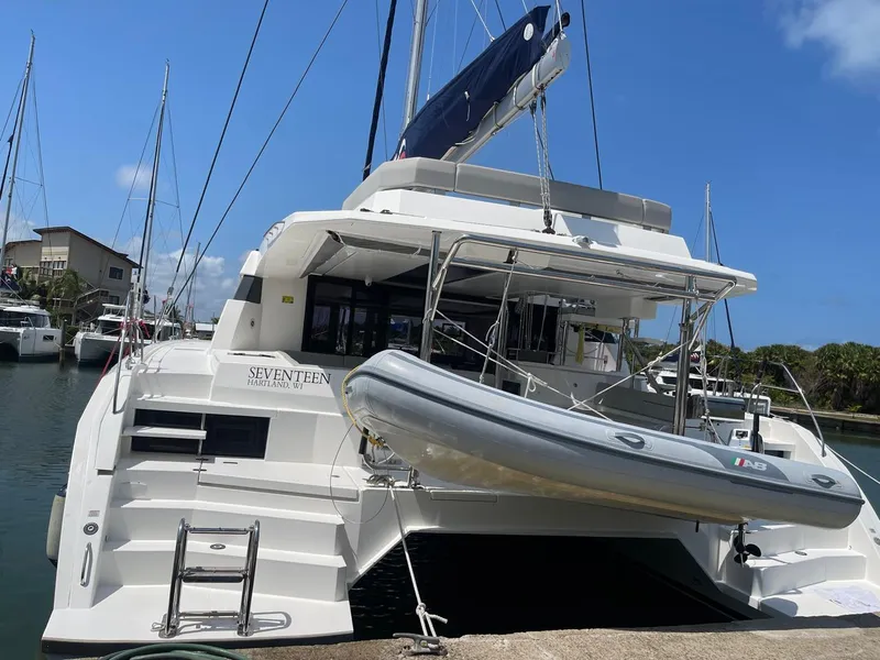 Slide: The Image of Leopard 50 catamaran yacht docked with dinghy, 2020 model. - 3