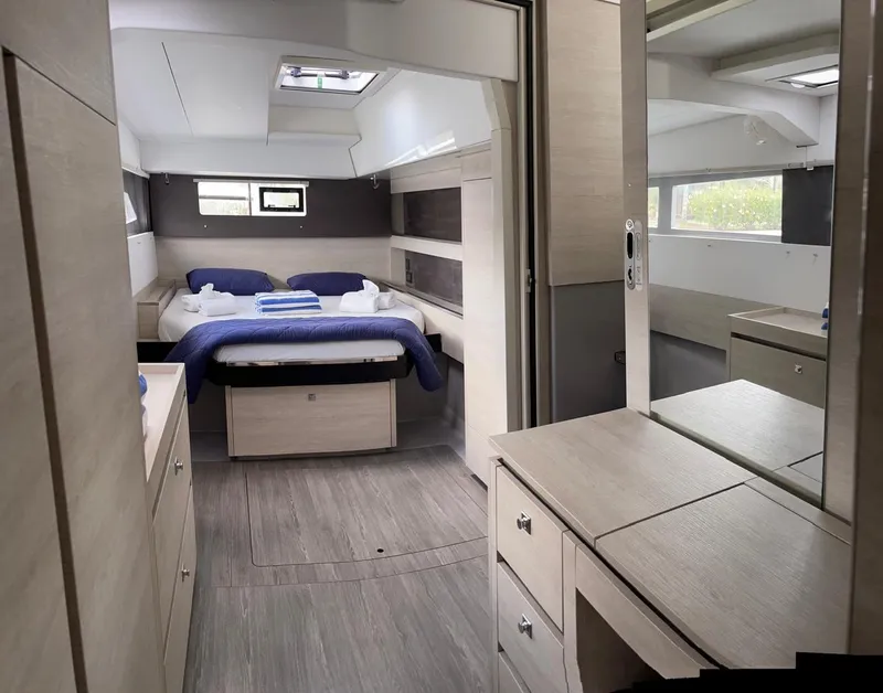 Slide: The Image of Modern interior of a 2020 Leopard 50 yacht with a cozy bedroom. - 38
