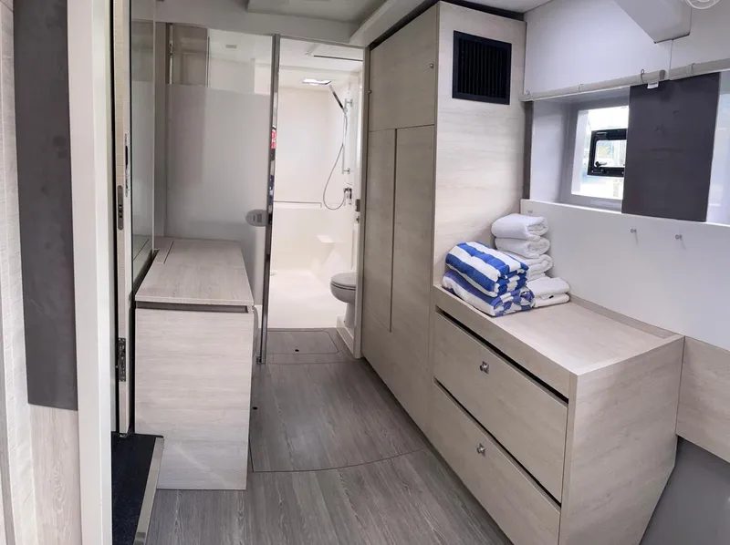 Slide: The Image of Modern interior of Leopard 50 yacht, 2020 model, featuring bathroom and storage area. - 39