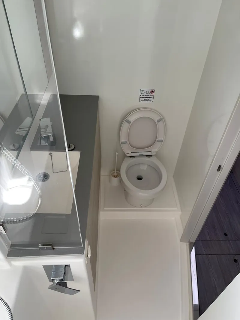Slide: The Image of Modern bathroom in a 2020 Leopard 50 yacht with toilet and sink. - 45