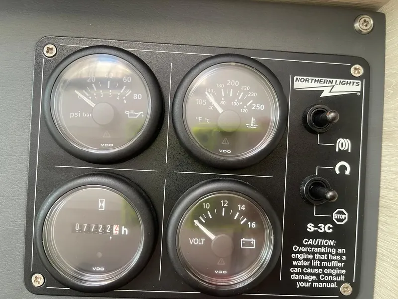 Slide: The Image of Control panel of a 2020 Leopard 50 boat with gauges and warning labels. - 9