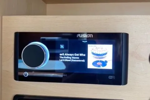 Slide: The Image of Fusion stereo system on a 2012 Sea Ray 370 Sundancer displaying music by The Rolling Stones. - 19