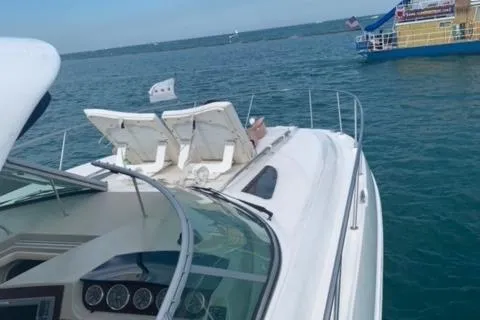 Slide: The Image of Sea Ray 370 Sundancer 2012 yacht on open water with clear skies. - 23