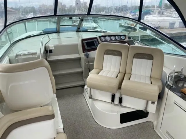 Slide: The Image of Interior cockpit of 2012 Sea Ray 370 Sundancer yacht with dual captain chairs. - 6