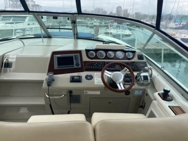 Slide: The Image of Helm of 2012 Sea Ray 370 Sundancer with modern controls and navigation equipment. - 7