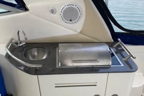 Slide: The Image of Outdoor kitchenette on a 2012 Sea Ray 370 Sundancer yacht with sink and grill. - 9