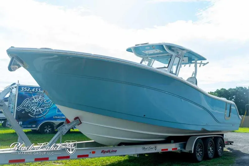 Slide: The Image of 2025 Sea Fox 328 Commander Center Console boat on trailer. - 0