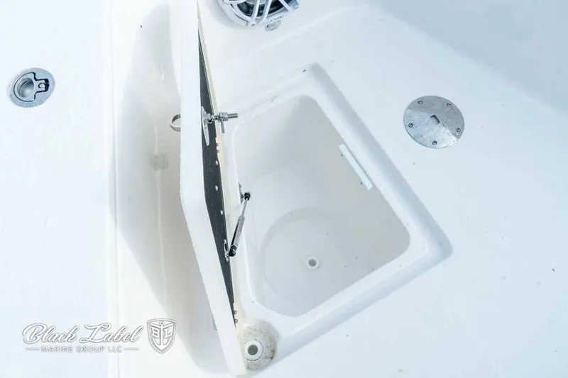 Slide: The Image of Open storage compartment on 2025 Sea Fox 328 Commander Center Console boat. - 10