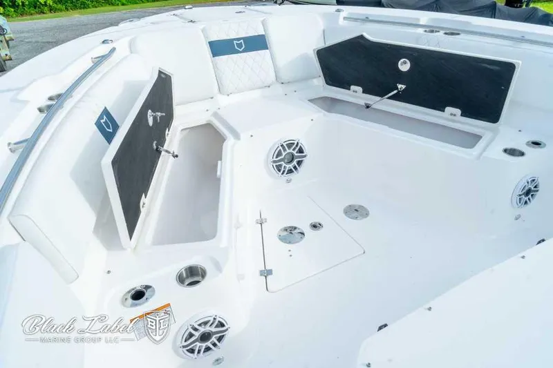 Slide: The Image of 2025 Sea Fox 328 Commander Center Console boat interior with storage compartments. - 11