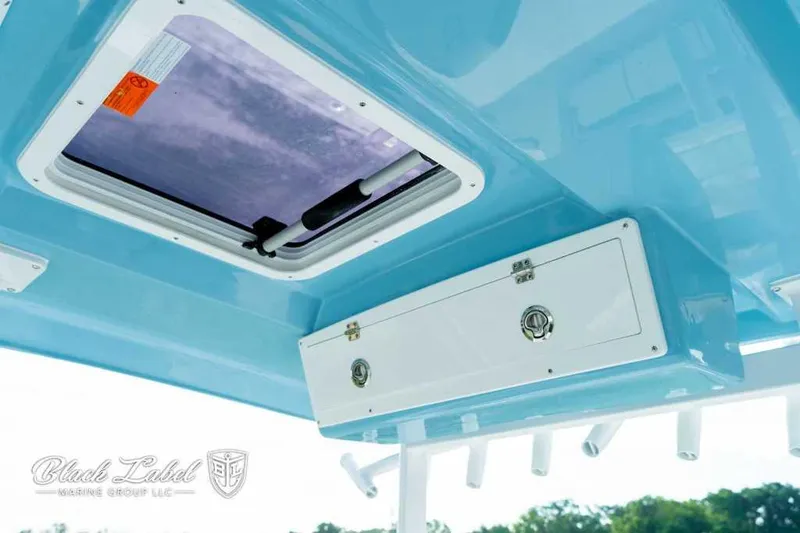 Slide: The Image of 2025 Sea Fox 328 Commander Center Console boat interior with storage compartment and hatch. - 22