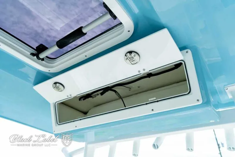 Slide: The Image of 2025 Sea Fox 328 Commander Center Console storage compartment. - 23