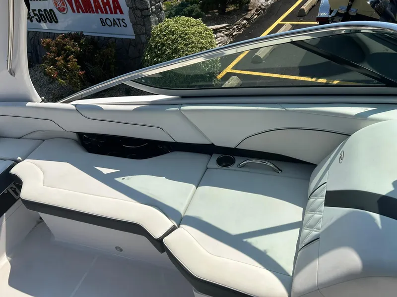 Slide: The Image of 2018 Regal 2300 Bowrider interior seating with cup holders and sleek design. - 11