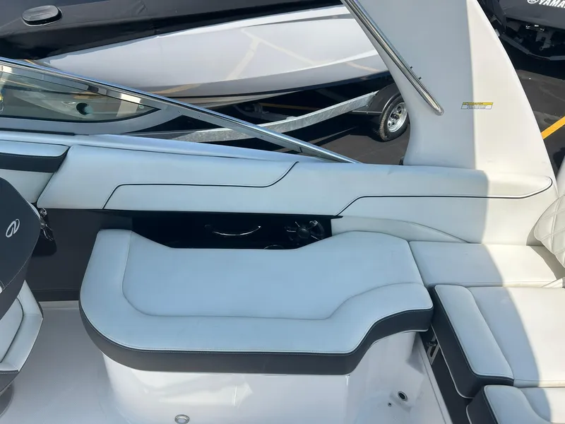 Slide: The Image of 2018 Regal 2300 Bowrider interior seating with white and black upholstery. - 13