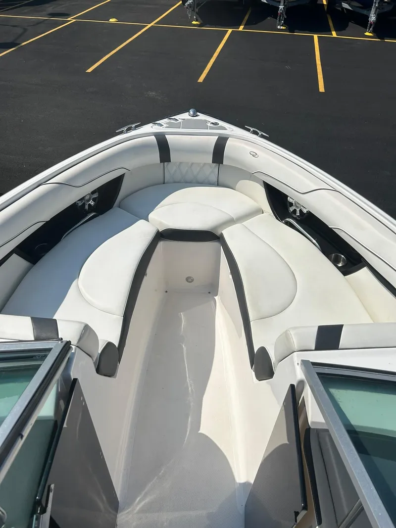 Slide: The Image of 2018 Regal 2300 Bowrider boat with spacious white seating area. - 5