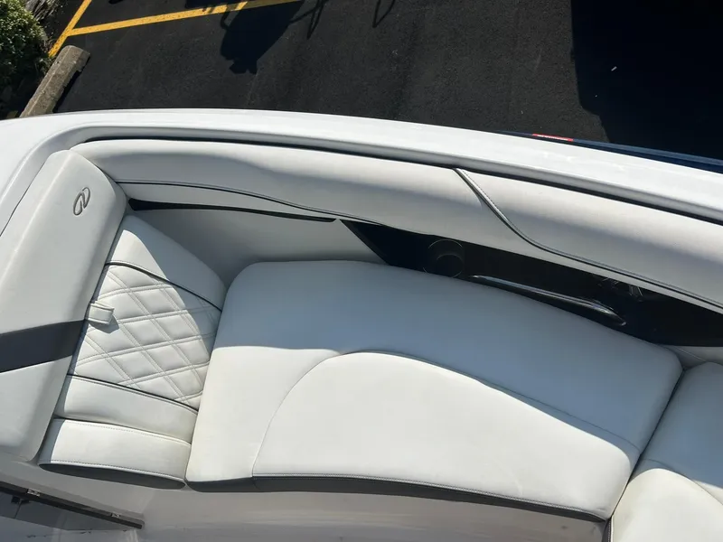 Slide: The Image of 2018 Regal 2300 Bowrider boat with white leather seating. - 7