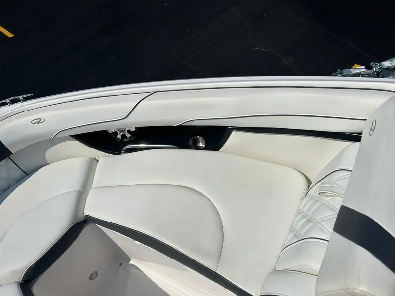Slide: The Image of 2018 Regal 2300 Bowrider boat interior with white leather seating. - 8