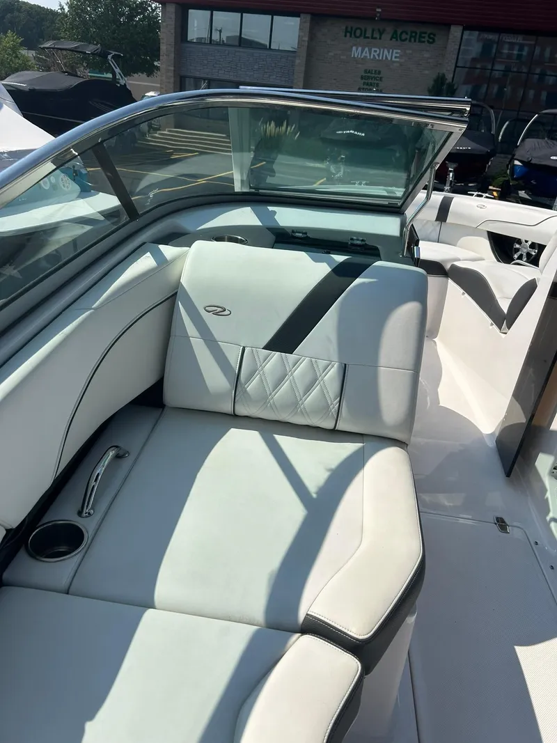 Slide: The Image of 2018 Regal 2300 Bowrider interior seating with white upholstery. - 9