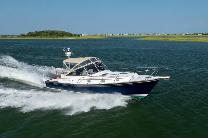 Slide: The Image of 1998 Little Harbor WhisperJet 36 cruising on open water. - 10