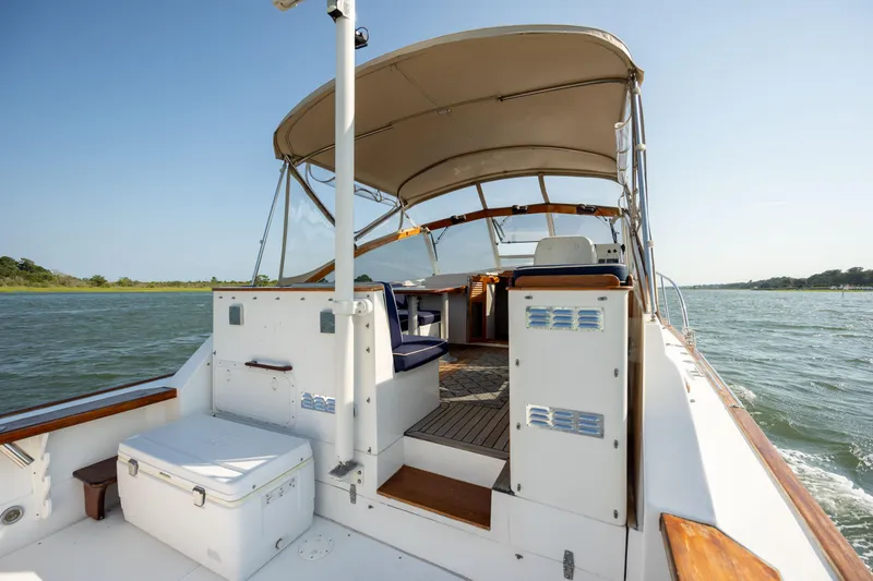 Slide: The Image of 1998 Little Harbor WhisperJet 36 boat with canopy on the water. - 14