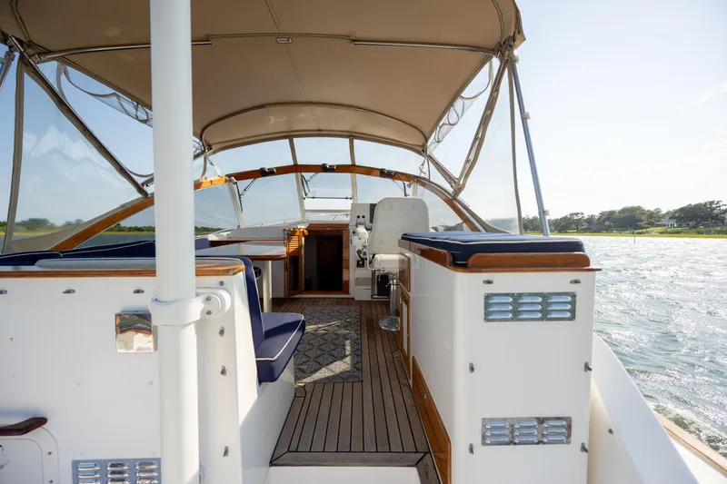 Slide: The Image of 1998 Little Harbor WhisperJet 36 interior with canopy, seating, and helm station. - 15