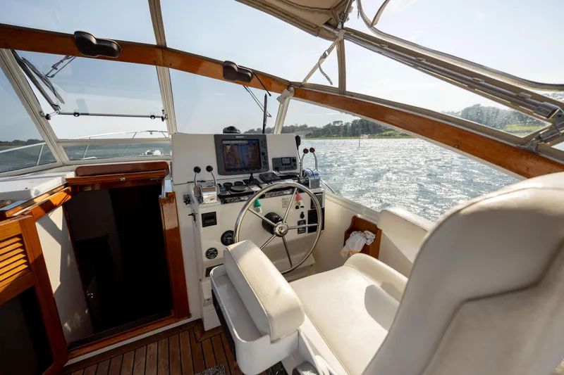 Slide: The Image of 1998 Little Harbor WhisperJet 36 helm station with navigation equipment and scenic water view. - 19