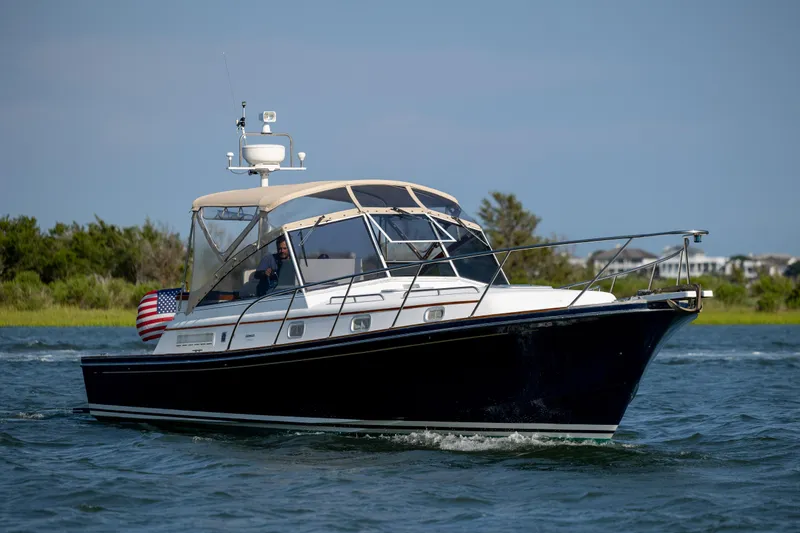 Slide: The Image of 1998 Little Harbor WhisperJet 36 cruising on water. - 2