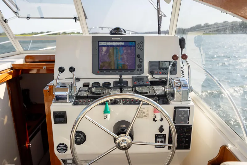 Slide: The Image of 1998 Little Harbor WhisperJet 36 helm with navigation equipment and steering wheel. - 20