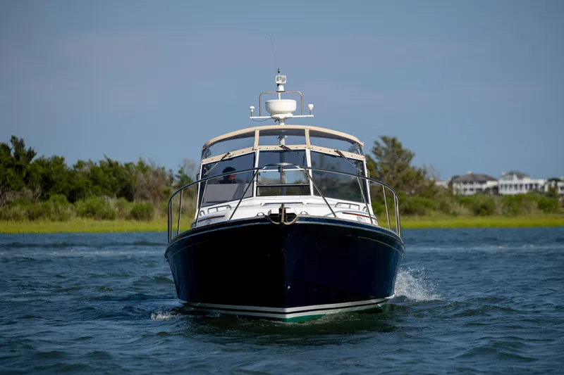 Slide: The Image of 1998 Little Harbor WhisperJet 36 cruising on water, front view. - 3