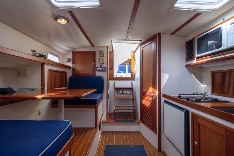Slide: The Image of Interior of 1998 Little Harbor WhisperJet 36 yacht with dining area and kitchenette. - 30