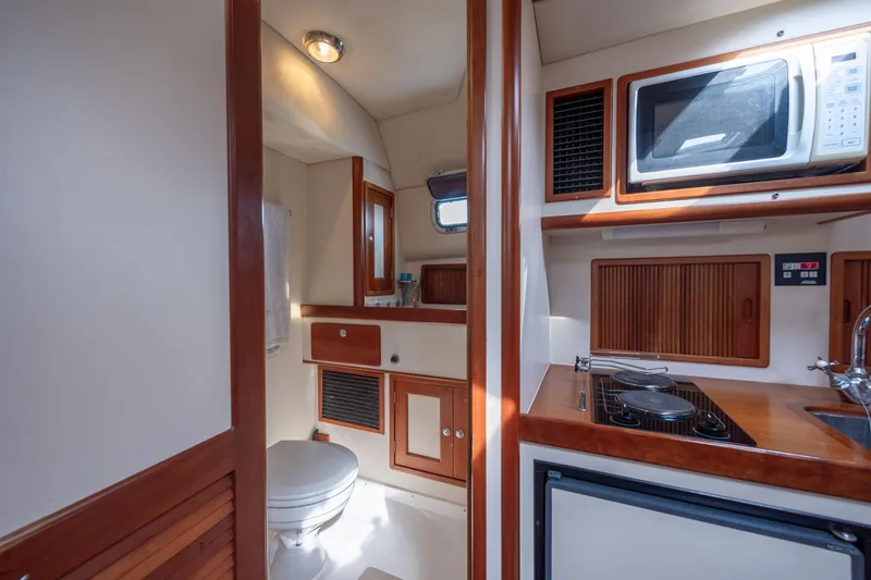 Slide: The Image of 1998 Little Harbor WhisperJet 36 interior with kitchenette and bathroom. - 31