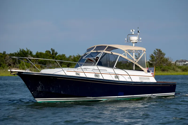 Slide: The Image of 1998 Little Harbor WhisperJet 36 cruising on the water. - 4