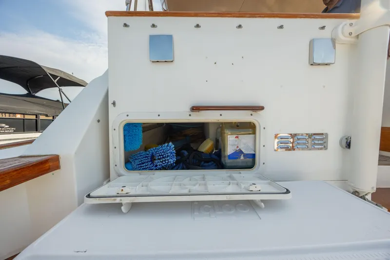 Slide: The Image of 1998 Little Harbor WhisperJet 36 storage compartment with cleaning supplies. - 45