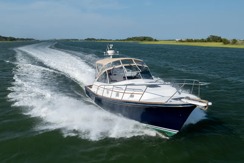 Slide: The Image of 1998 Little Harbor WhisperJet 36 cruising on open water. - 6