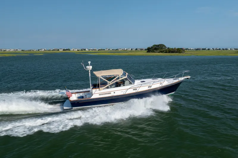 Slide: The Image of 1998 Little Harbor WhisperJet 36 cruising on open water. - 7