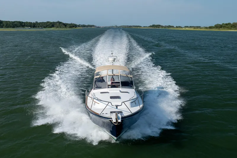 Slide: The Image of 1998 Little Harbor WhisperJet 36 cruising on open water. - 8