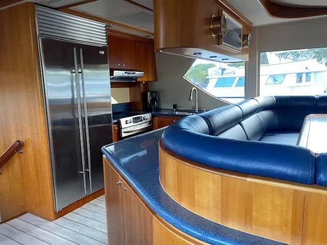 Slide: The Image of Luxurious interior of 2003 West Bay 68 yacht with modern kitchen and seating area. - 10