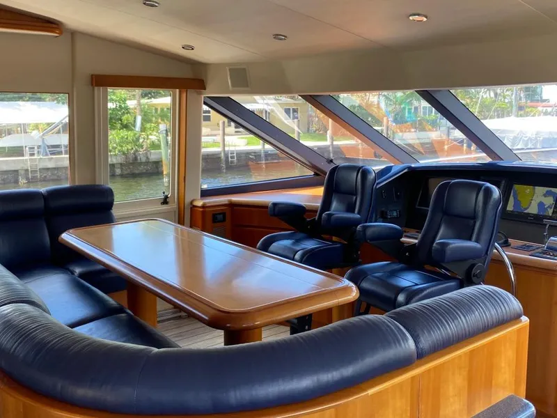 Slide: The Image of Luxurious interior of 2003 West Bay 68 yacht with leather seating and panoramic windows. - 12