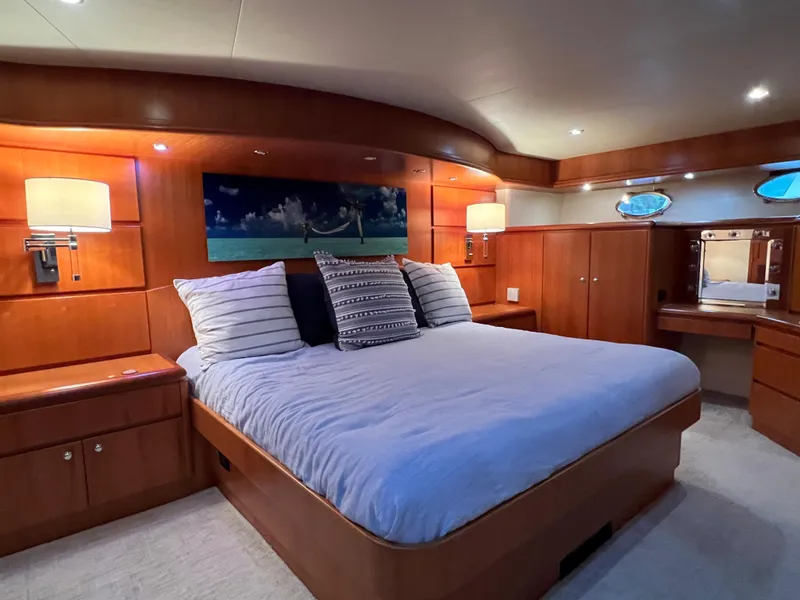 Slide: The Image of Luxurious bedroom interior of 2003 West Bay 68 yacht with elegant wood finishes. - 13