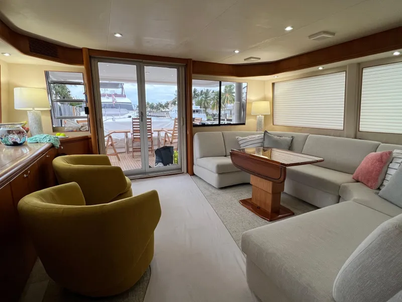 Slide: The Image of Luxurious interior of 2003 West Bay 68 yacht with elegant seating and ocean view. - 16