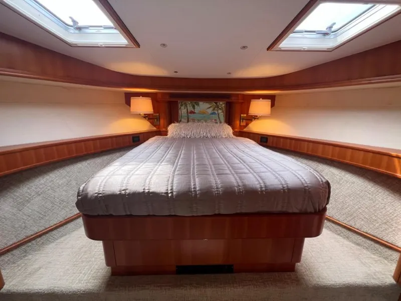 Slide: The Image of Luxurious bedroom interior of 2003 West Bay 68 yacht with skylights and elegant wood finish. - 18