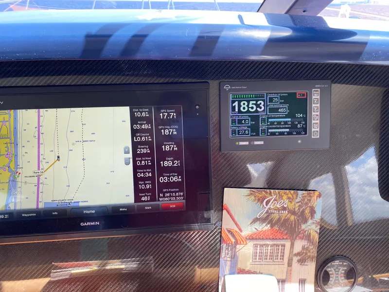 Slide: The Image of Dashboard of a 2003 West Bay 68 yacht with navigation and control displays. - 31