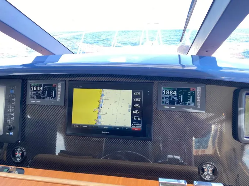 Slide: The Image of Helm of 2003 West Bay 68 yacht with navigation screens and ocean view. - 33